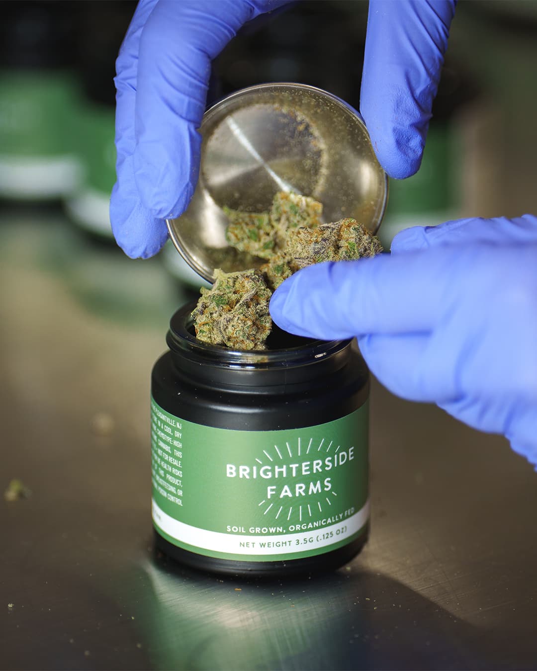 Top-shelf brighterside flower in branded glass jar