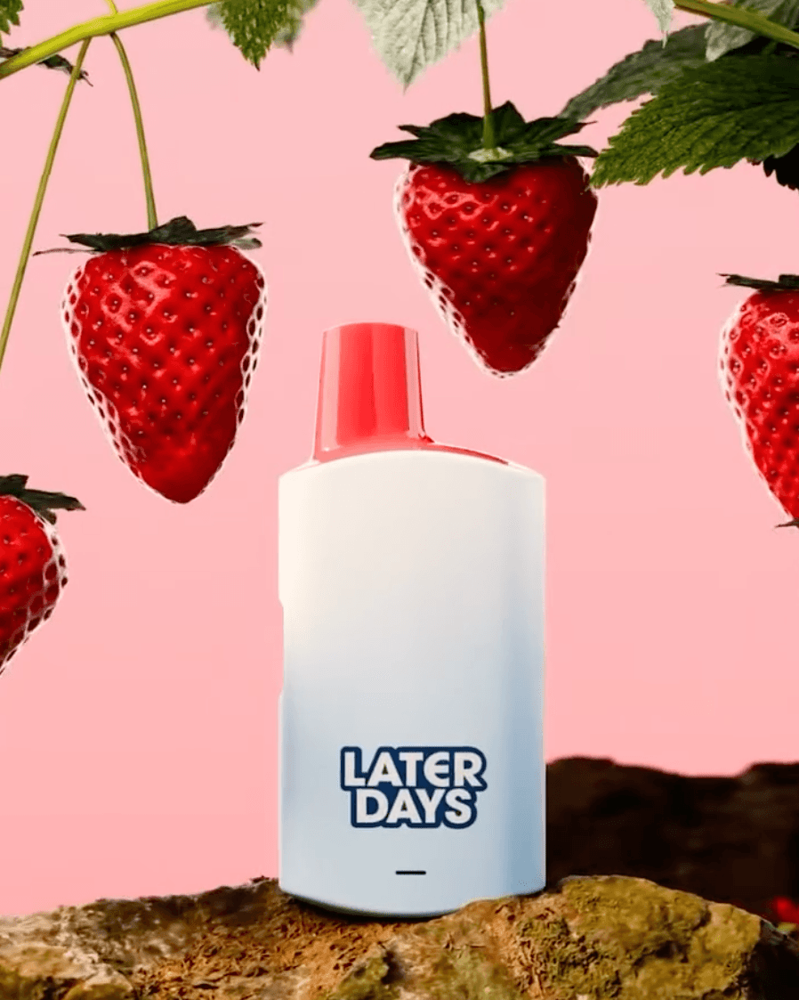 Days strawberry flavor vape surrounded by ripe strawberries on a pink background at Hashery NJ